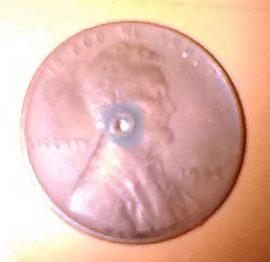I-Have-Two-Wheat-Pennies-With-Square-Holes-Punched-In-Them.